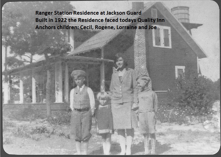 Anchors children in front of Ranger Station residence
